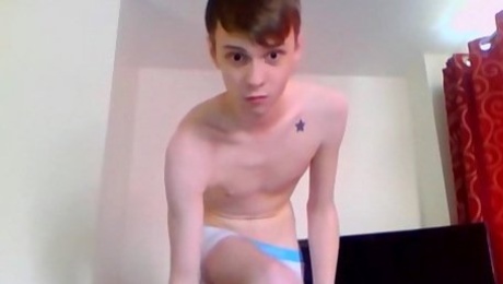 Wide eyed solo teen boy jerks off