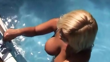 Big boobed German blonde fucked by the pool